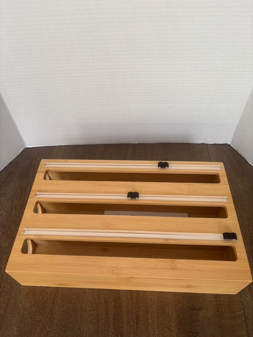 3-in-1 bamboo plastic wrap, aluminum foil, and parchment paper dispenser.